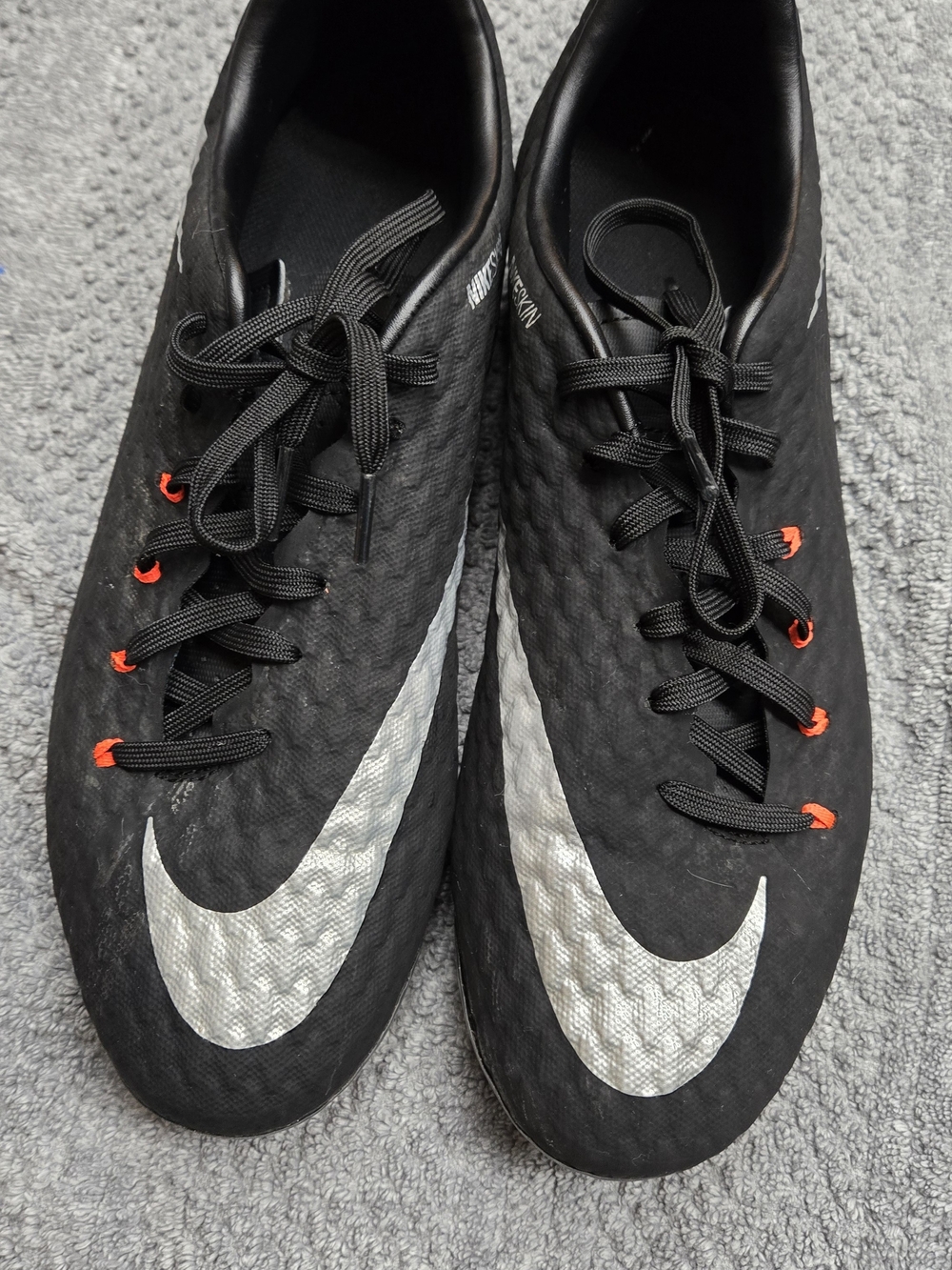 Nike Boys Black Athletic Soccer Cleats with Silver Swoosh and Orange Eyelets